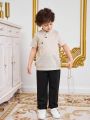 SHEIN Kids Nujoom Young Boy'S Irregular Placket Stand Collar Button Half-Open Shirt