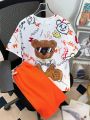 SHEIN Kids EVRYDAY 2pcs/Set Loose Fit Casual Round Neck Short Sleeve T-Shirt And Shorts With Cartoon Bear Graffiti Pattern For Tween Boys