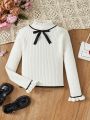 SHEIN Kids QTFun Girls' Cute Slim Fit Bowknot Round Neck Pullover Sweater With Long Sleeves
