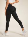 Solid Color Ladies' Sports Leggings With Ruched Detail