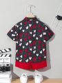 SHEIN Kids QTFun Young Boy Heart Printed Short Sleeve Shirt And Shorts Set