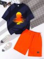 SHEIN Kids SUNSHNE Boys' Seaside Sunset Printed Round Neck Short Sleeve Top With Clean Patch Detail Shorts 2pcs/Set
