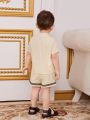 SHEIN Baby Boy Geometric Pattern Woven Tape Short Sleeve Top And Shorts Set