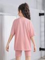 SHEIN Kids Cooltwn Tween Girls' Loose Knit Short Sleeve T-Shirt With Slogan Print + Slim Fit Shorts Sports Set