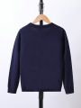 SHEIN Tween Boys Solid Color Diagonal Button Sweater