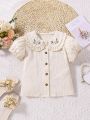 SHEIN Kids EVRYDAY Young Girls' Casual Woven Shirt With Doll Collar, Ruffle Trim, Floral Embroidery And Puff Sleeves