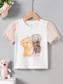 SHEIN Kids QTFun Toddler Girls' Round Neck Double Layered Sparkly Mesh Ruffle Sleeve Printed T-Shirt With Patchwork