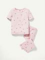 Cozy Cub Baby Girl Snug Fit Pajama Set With Short-Sleeve Round Neck Top And Footed Pants In 2pcs