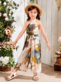 SHEIN Kids EVRYDAY Young Girl's Woven Loose Fit Jumpsuit With Single Shoulder And Leaf Printing Pattern