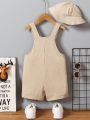 SHEIN Kids SUNSHNE Toddler Boys' Casual Jumpsuit With Cute Checks Suspenders And Solid Color Fisherman Hat