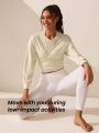 SHEIN Leisure Women's Solid Color Round Neck Wrap Front Pleated Athletic Sweatshirt