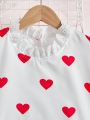 SHEIN Kids EVRYDAY Girls' Love Heart Printed Stand Collar Shirt With Ruffled Hem