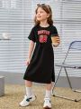 SHEIN Kids Nujoom Girls' Knit Solid Color Printed Round Neck Casual Batwing Sleeve Dress With Waist Belt