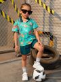 SHEIN Kids SUNSHNE Little Boys' Cartoon Animal Printed Top And Solid Color Shorts Set