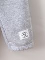 SHEIN Kids EVRYDAY Toddler Boys' Comfy & Cool Classic All-Match 2pcs/Set Sweatpants With Letter Patched, Spring/Summer