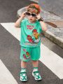 SHEIN Young Boy Cute And Comfortable Surfer Character Pattern Short-Sleeved Top And Shorts Set