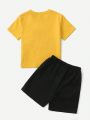 SHEIN Kids EVRYDAY Young Boys' Casual Dinosaur Printed Short Sleeve T-Shirt And Shorts Set