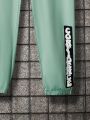 SHEIN Kids KDOMO Boys' (Big) Slogan Printed Short Sleeve T-Shirt And Pants Two-Piece Set