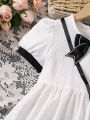 SHEIN Kids FANZEY Young Girl's Color Block Puff Sleeve Dress With Bow Decoration