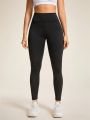Solid Color Ladies' Sports Leggings With Ruched Detail