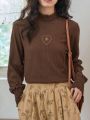 FRIFUL Women's Long Sleeve T-shirt With Stand Collar And Heart Embroidery Detail