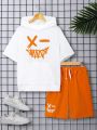 SHEIN Teen Boy's Casual Hooded T-Shirt With Smiling Face Printed And Drawstring Waist Shorts Set