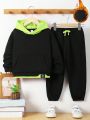 SHEIN Young Boy Loose Fit Colorblock Hooded Fleece Sweatshirt With 2 In 1 Design, And Solid Knitted Pants