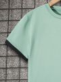 SHEIN Kids KDOMO Boys' (Big) Slogan Printed Short Sleeve T-Shirt And Pants Two-Piece Set