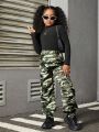 SHEIN Kids HYPEME Tween Girls' Stand Collar Ribbed Long Sleeve T-Shirt And Camouflage Cargo Pants Two-Piece Set