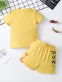 SHEIN Kids QTFun Young Boys' Casual And Cute Lion Printed Short Sleeve T-Shirt With Slogan And Shorts For Summer