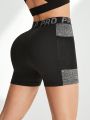 Letter Tape Contrast Color Sport Shorts With Phone Pocket
