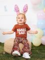 SHEIN Baby Girls' Casual Letter Print Short Sleeve Top And Floral Flared Pants Set