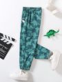 SHEIN Kids EVRYDAY Toddler Boys' Cute Cartoon Dinosaur Printed Loose Fit Pants For Comfortable And Casual Spring