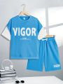 SHEIN Tween Boys' Casual Letter Print 2 In 1 Short Sleeve Tee With Color Block Sleeves Design And Shorts Knitted Two Piece Set