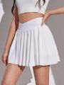 SHEIN Teenage Girls' Knitted Solid Color Sport Skirt With Built-In Anti-Light Primer Shorts And Pleats