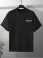 Manfinity EMRG Loose Fit Men's Slogan Printed Drop Shoulder Short Sleeve T-Shirt