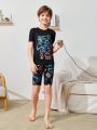 SHEIN Tween Boys' Tight-Fitting Casual Round Neck Short Sleeve T-Shirt With Glow-In-The-Dark Print And Shorts Homewear Set
