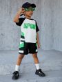 SHEIN Kids SPRTY Young Boys' Sporty Round Neck Short Sleeve T-Shirt And Shorts Set With Letter Print