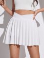 SHEIN Teenage Girls' Knitted Solid Color Sport Skirt With Built-In Anti-Light Primer Shorts And Pleats