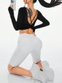 SHEIN Sport Studio Solid Color Slim Fit Long Sleeve Sports T-Shirt With Twist Back Knot And Round Neckline