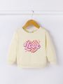 Baby Girl Heart & Letter Graphic Sweatshirt