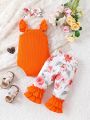 2pcs Baby Girls' Elegant Orange Printed Romper With Flower Embellishment And Flare Pants Summer Outfits