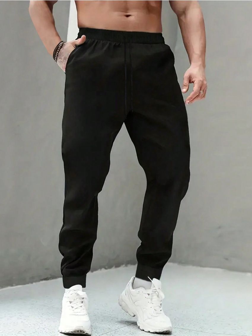 Men Plus Solid Slant Pocket Drawstring Waist Sweatpants
