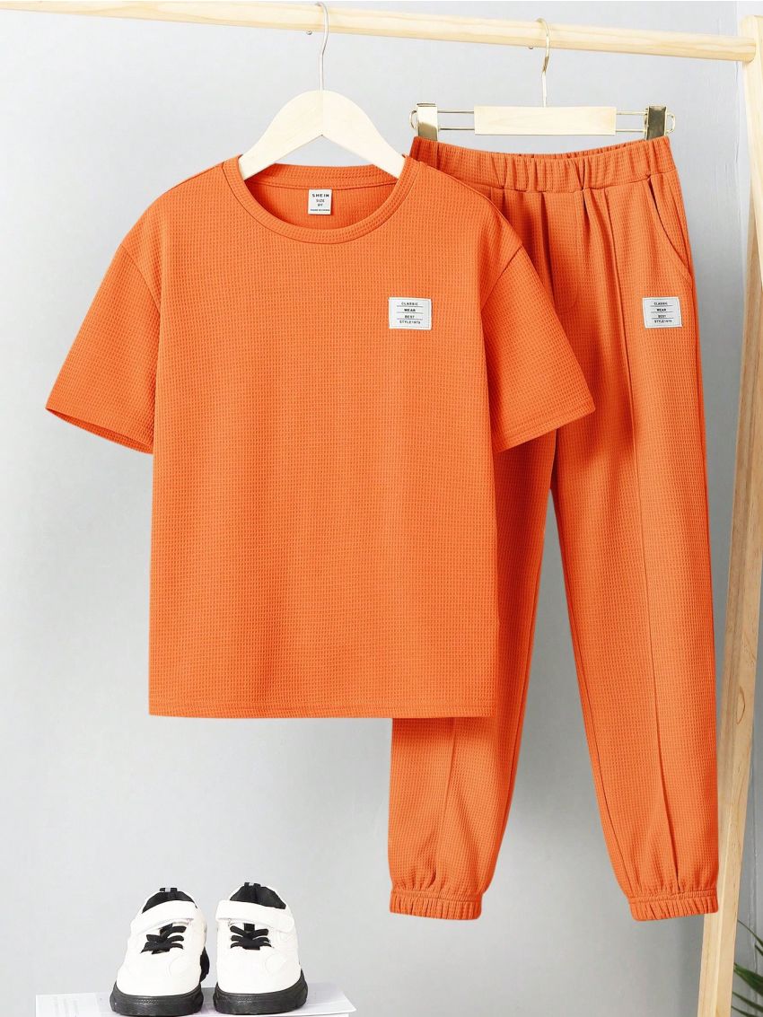 SHEIN Kids EVRYDAY Tween Boys' Round Neck Short Sleeve T-Shirt And Pants Two-Piece Set