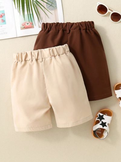 SHEIN Kids FANZEY Young Boy 2pcs Button Decorated Diagonal Pocket Shorts