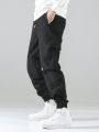 Extended Sizes Men's Solid Color Drawstring Cargo Pants