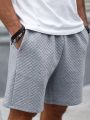 Manfinity Homme Men's Solid Color Elastic Waistband Shorts With Diagonal Pockets
