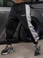 Men Letter Graphic Contrast Side Seam Drawstring Waist Sports Pants