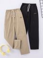 SHEIN Kids Nujoom Tween Boys' Loose Cute Woven Solid Color Pants 2pcs/Set