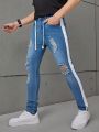 SHEIN Teenage Boys' Washed Ripped & Colorblock & Tight-Fitting & Stretch Denim Pants